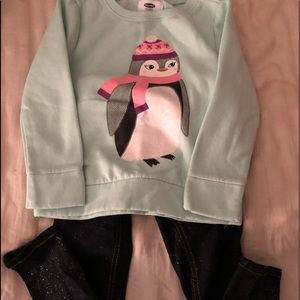 Girls penguin sweatshirt and pair of jeans